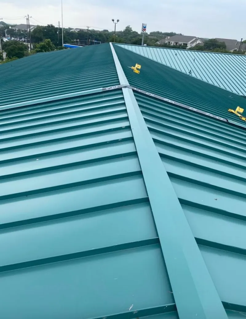 Green commercial metal roof ridge and valley for Metal Roof Repair in Belvedere Park