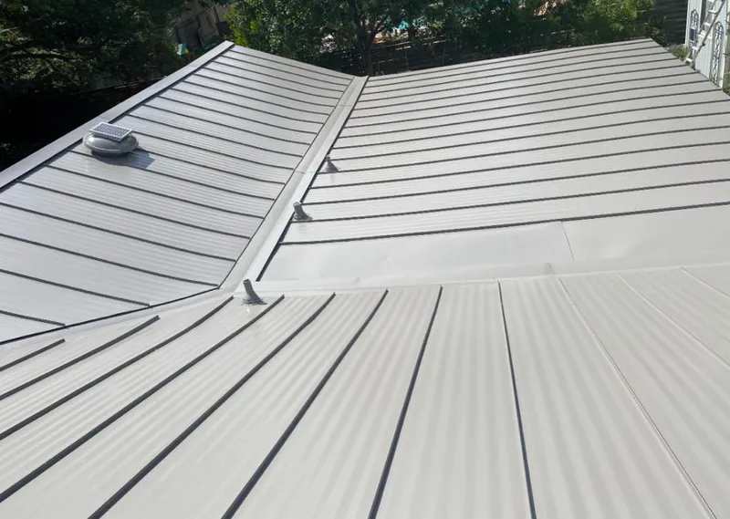 Solar attic fan installed on a metal roof for Roof Ventilation in Belvedere Park